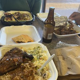 Curry chicken plate, oxtail plate, and jerk chicken
