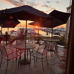 Waterfront Restaurant - View out the window to sunset beyond patio