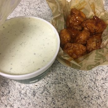 Wingstop - a huge vat of ranch + ancho honey glaze rub - Chicken Wings Near Me - Lubbock, Texas