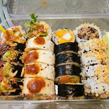 Komomo - a variety of sushi in a plastic container - Vegan Near Me - Montreal, Quebec Komomo - a variety of sushi in a plastic container - Vegan Near Me - Montreal, Quebec