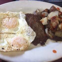 Rocky's - Over easy eggs sausage home fries.