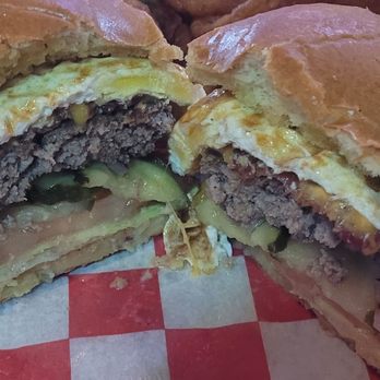 Arrowhead Sports Grill - The Hangover Burger. The egg (somewhat over cooked), bacon, cheese, burger patty (also somewhat over cooked), pickles, tomato & lettuce. - American Near Me - Plano, Texas Arrowhead Sports Grill - The Hangover Burger. The egg (somewhat over cooked), bacon, cheese, burger patty (also somewhat over cooked), pickles, tomato & lettuce. - American Near Me - Plano, Texas