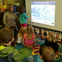 Appleseed Learning Center - Preschoolers learning through technology on an interactive whiteboard.