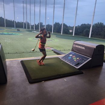 Topgolf - My daughter hit her 1st golf ball and was sooo excited! - New American Near Me - Atlanta, Georgia Topgolf - My daughter hit her 1st golf ball and was sooo excited! - New American Near Me - Atlanta, Georgia