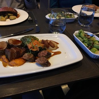 360 Restaurant - Pork tenderloin with brussell sprouts - prime rib and salmon in the background - Canadian (New) Near Me - Toronto, Ontario 360 Restaurant - Pork tenderloin with brussell sprouts - prime rib and salmon in the background - Canadian (New) Near Me - Toronto, Ontario