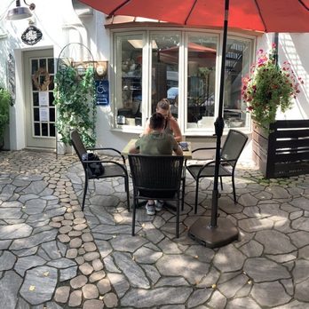 Brew House Coffee & Bake Shop - Back patio area is definite vibes and have hanging lights for night time! - Coffee & Tea Near Me - Maumee, Ohio