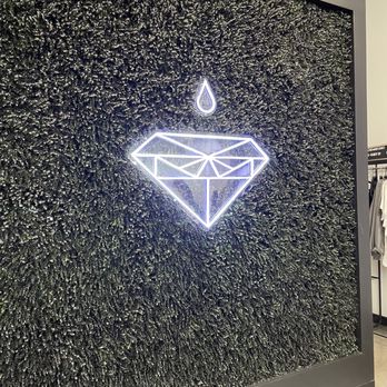 @392Caffe | Utica Ridge -  a neon sign of a diamond - Coffee & Tea Near Me - Davenport, Iowa