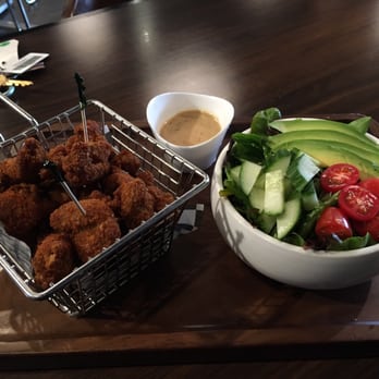 Rain Cafe - Spicy popcorn chicken with salad + sesame dressing on side. - Coffee & Tea Near Me - Seattle, Washington Rain Cafe - Spicy popcorn chicken with salad + sesame dressing on side. - Coffee & Tea Near Me - Seattle, Washington
