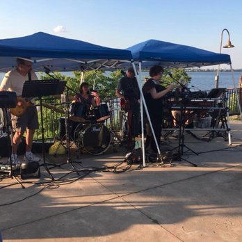 The Riverside Inn - a group of people playing music under a tent - Bars Near Me - Paulsboro, New Jersey The Riverside Inn - a group of people playing music under a tent - Bars Near Me - Paulsboro, New Jersey