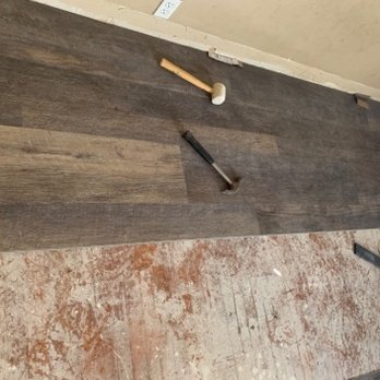 Torres Flooring - a wood floor with a hammer on it - Flooring Near Me Torres Flooring - a wood floor with a hammer on it - Flooring Near Me