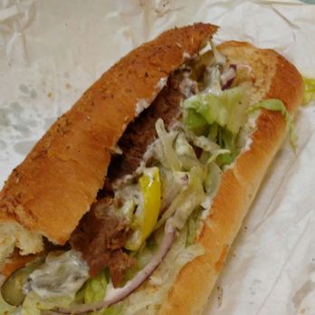 Subway - a sub sandwich with meat, onions, and lettuce - Sandwiches Near Me - Kennesaw, Georgia Subway - a sub sandwich with meat, onions, and lettuce - Sandwiches Near Me - Kennesaw, Georgia