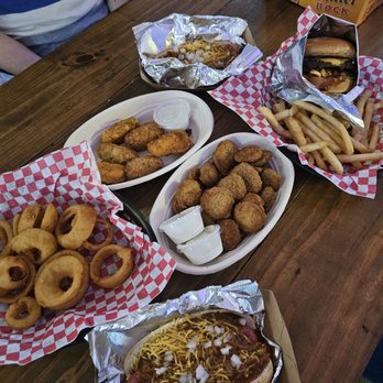 The Thirsty Longhorn - Chili cheese dog, onion rings, pickle chips, Jalapeño poppers, frito burger and great seasoned fries. - Sports Bars Near Me - Georgetown, Texas The Thirsty Longhorn - Chili cheese dog, onion rings, pickle chips, Jalapeño poppers, frito burger and great seasoned fries. - Sports Bars Near Me - Georgetown, Texas