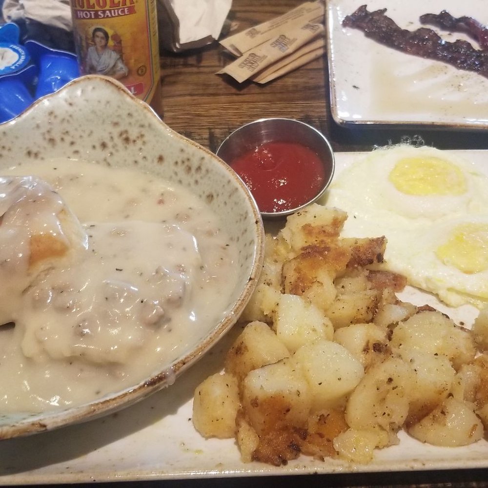 First Watch - Biscuits and Turkey Sausage Gravy with Eggs and Potatoes with Million Dollar Bacon on the side. - Breakfast & Brunch Near Me - Riverview, Florida
