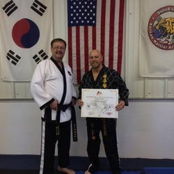 Georgia Hapkido Academy - Master Instructor Popham receiving is 4th Dan Black Belt! Way to go Mr. Popham, we are so proud of you!