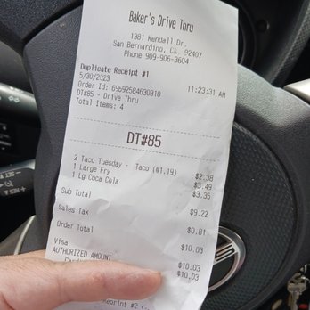 Baker's Drive-Thru - a hand holding a receipt - Burgers Near Me - San Bernardino, California Baker's Drive-Thru - a hand holding a receipt - Burgers Near Me - San Bernardino, California