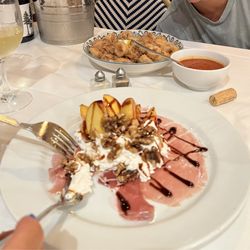 Capitano - Peach, prosciutto and ricotta appetizer. Fried calamari in background.