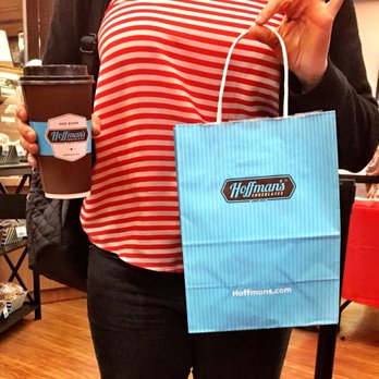 Hoffman's Chocolates - a woman holding a cup of coffee - Ice Cream & Frozen Yogurt Near Me - Greenacres, Florida Hoffman's Chocolates - a woman holding a cup of coffee - Ice Cream & Frozen Yogurt Near Me - Greenacres, Florida