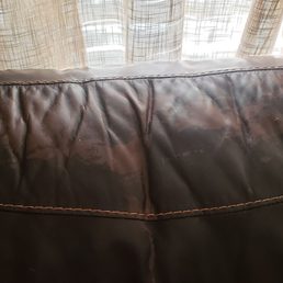 Picture of the peeling "leather" couch that is now irritating my neck. Goof proof and extended warrentee not being honored. Picture of the peeling "leather" couch that is now irritating my neck. Goof proof and extended warrentee not being honored.