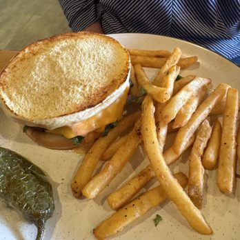 Brekki Brekki - My friend's hamburger melt. Looked like two hamburgers on there with American cheese and fries with pickled jalapeno on the side. - Breakfast & Brunch Near Me - Albuquerque, New Mexico