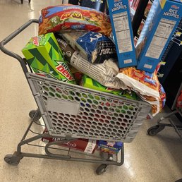 a shopping cart full of snacks