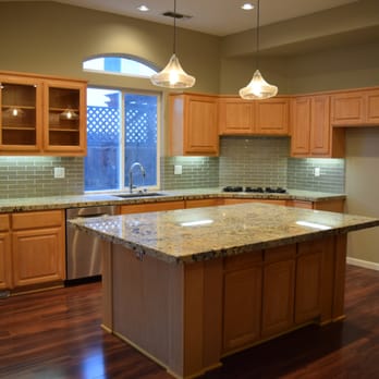 Jerry Saunders Construction - a kitchen with a center island - General Contractors Near Me - Modesto, California Jerry Saunders Construction - a kitchen with a center island - General Contractors Near Me - Modesto, California