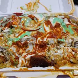 Combo with spicy rice, red, green and white sauce So freaking good. Combo with spicy rice, red, green and white sauce So freaking good.