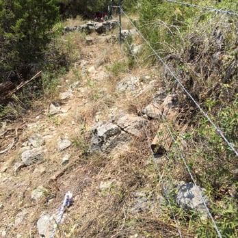 Pro-Fence - Fenced in rough terrain land.  I was out of town trying to coordinate, they took photos for us and emailed them after completion. - Fences & Gates Near Me - Leander, Texas