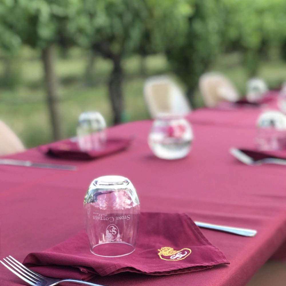 Stone Cottage Cellars - a table set for a wine tasting - Wineries Near Me - Paonia, Colorado Stone Cottage Cellars - a table set for a wine tasting - Wineries Near Me - Paonia, Colorado