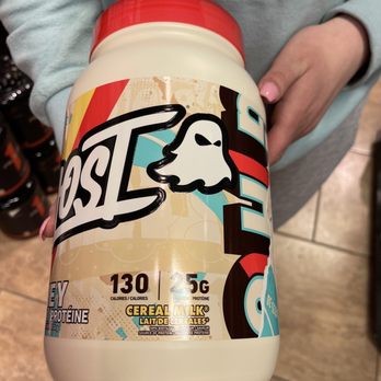 Supplement King - Edmonton - a person holding a bottle of milk - Health Markets Near Me - Edmonton, Alberta