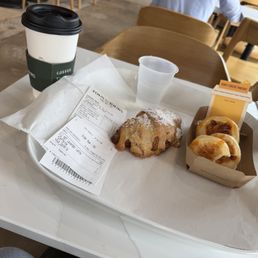 Lavender Latte with oat milk , almond croissant and honey cheese pancakes Lavender Latte with oat milk , almond croissant and honey cheese pancakes