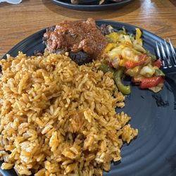 Ginnie's Cafe and African Cuisine - Curry Goat 16oz Jollof w/ Goat