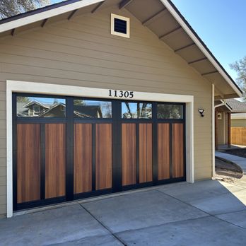 Coldani Insulation & Garage Doors - New Shoreline garage door with Cedar and Black Overlay design and clear glass windows. - Insulation Installation Near Me Coldani Insulation & Garage Doors - New Shoreline garage door with Cedar and Black Overlay design and clear glass windows. - Insulation Installation Near Me