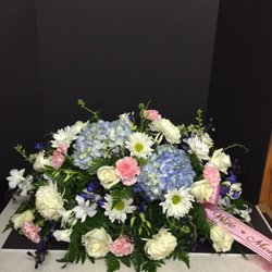 Pam's Petals - Blue & white casket spray with a couple pops of pink