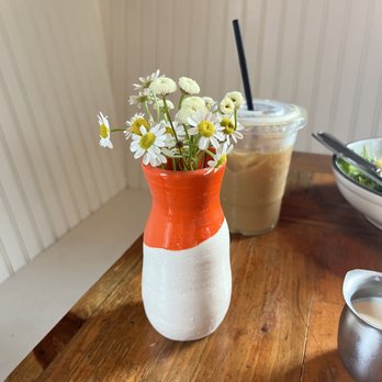 Haute Coffee - a vase of flowers on a table - Coffee & Tea Near Me - Concord, Massachusetts