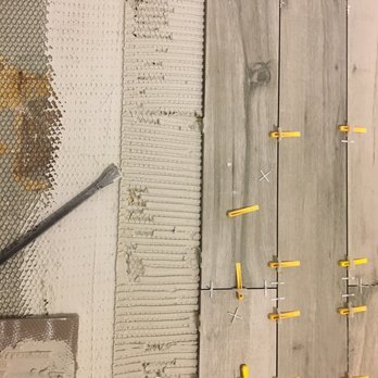 Blue Lake Enterprises - Tile was not pressed down to ensure proper mortar coverage. - General Contractors Near Me