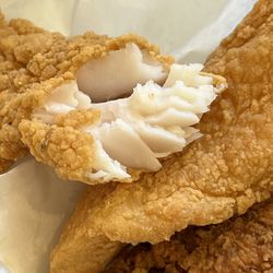 Louisiana Fried Chicken - Catfish above and a chicken thigh below
