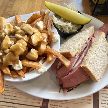 Phil Smoked Meat - The Suisse, which was smoked meat, Swiss cheese, coleslaw, and mustard, along with fries upgraded to poutine - Sandwiches Near Me - Quebec City, Quebec Phil Smoked Meat - The Suisse, which was smoked meat, Swiss cheese, coleslaw, and mustard, along with fries upgraded to poutine - Sandwiches Near Me - Quebec City, Quebec