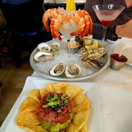 Local oysters on the half shell, Chilled pink shrimp, and Tuna tartare for Happy Hour.