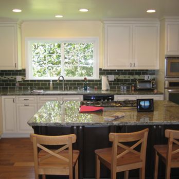Foote Construction - a kitchen with a center island - General Contractors Near Me