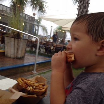 The Gulf - My poor son eating his food in the pouring rain - Burgers Near Me - Orange Beach, Alabama The Gulf - My poor son eating his food in the pouring rain - Burgers Near Me - Orange Beach, Alabama