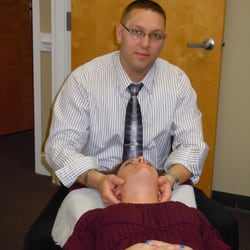 Upper Hand Chiropractic - Adjusting a patient