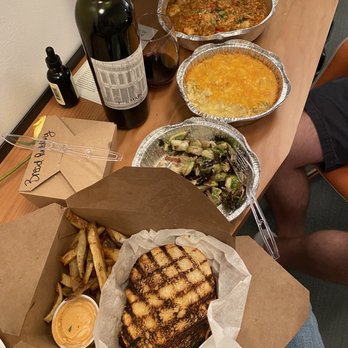 HATTAWAY'S - The amazing pulled pork sandwich (front), brussel sprouts with bacon, baked Mac and cheese, shrimp perloo - Southern Near Me - Walla Walla, Washington