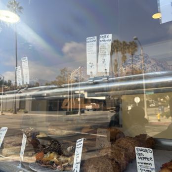 Seed Bakery - Window display of some of the goods - empanadas are very yummy!!! - Bakeries Near Me - Pasadena, California