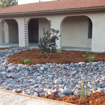 Haven Landscaping - Before there was no cement between the arches. Only dirt. The entry way was a combination of tiled concrete pads and dirt. - Landscaping Near Me Haven Landscaping - Before there was no cement between the arches. Only dirt. The entry way was a combination of tiled concrete pads and dirt. - Landscaping Near Me