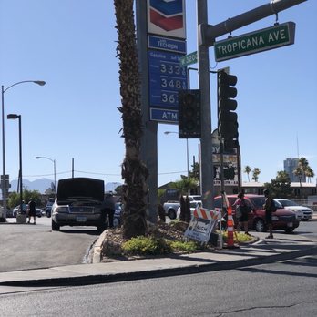Chevron - a gas station with a gas station sign in the foreground - Gas Stations Near Me - Las Vegas, Nevada