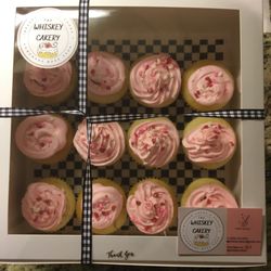 Whiskey Cakery Boise - Strawberry-filled vanilla cupcakes with a light whipped frosting and Valentine's Day sprinkles (comes with 12 "pipettes" for alcohol/cider)