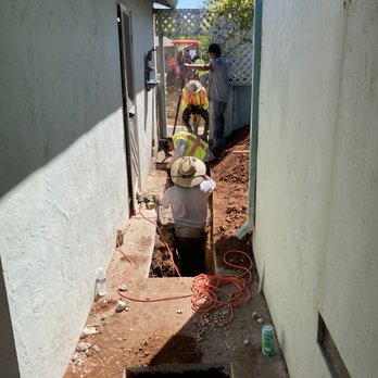 Streamline Plumbing - Crew trenching for sewer lateral carefully avoiding gas and water lines. - Plumbing Near Me