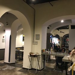 Comal - Interior view of architecture with social distancing tables. Clean and modern.