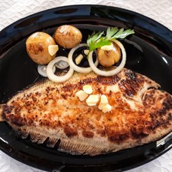 Rio Mondego - Delicious grilled sole cooked in olive oil and garlic and accompanied by potatoes and onions.