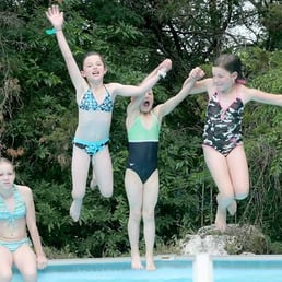 kids swimming after riding